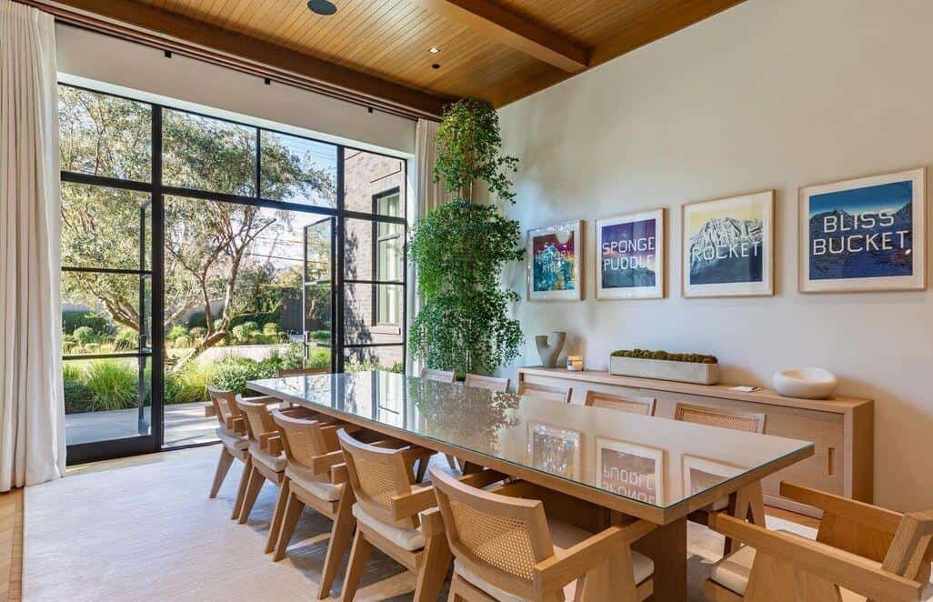 Modern conference room with large windows and natural light.