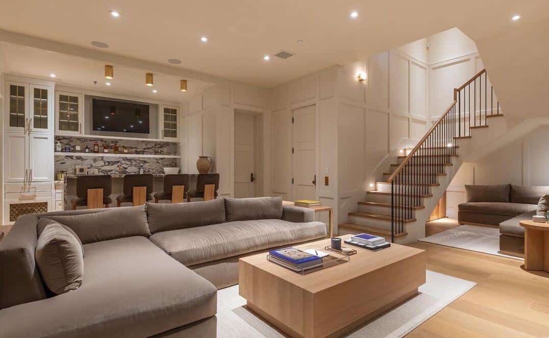 Elegant living room with modern decor, comfortable seating, and stylish lighting.